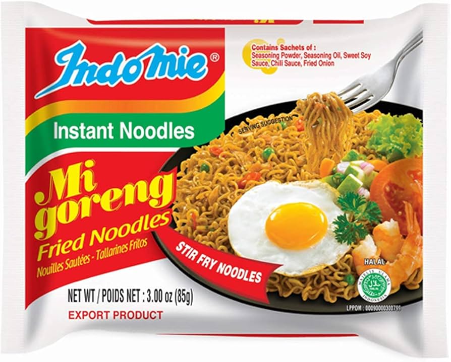 Indomie Mi Goreng Fried Noodles packaging with a bowl of noodles, egg, and vegetables on a white background.